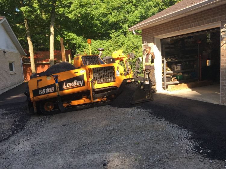 paving equipment on a residential job site