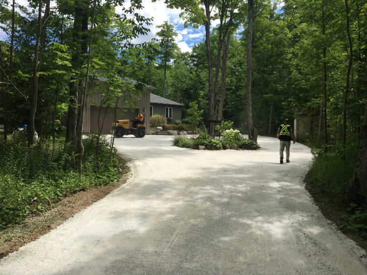 prepping driveway with gravel before paving with asphalt