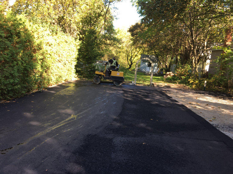 smoothing out the asphalt at a residential property