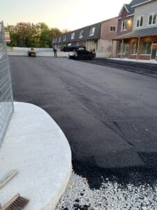 just finishing up a freshly paved commercial parking lot