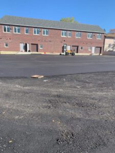 just finishing up a freshly paved commercial parking lot