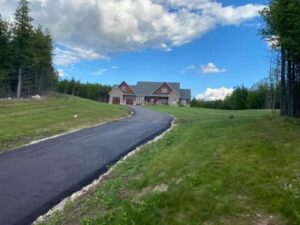 long residential driveway paved with asphalt in Grand Valley