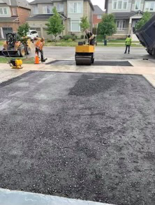 rolling a residential driveway in Acton