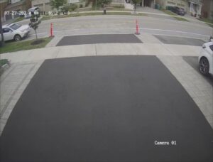 Perfectly smooth asphalt driveway in Acton