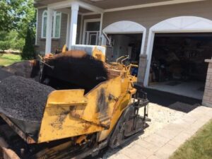 asphalt loaded and ready to be laid on residential driveway in Beeton