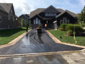Residential Nobleton driveway with a finished asphalt driveway