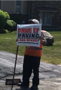 marking a site with a Pave it Paving sign